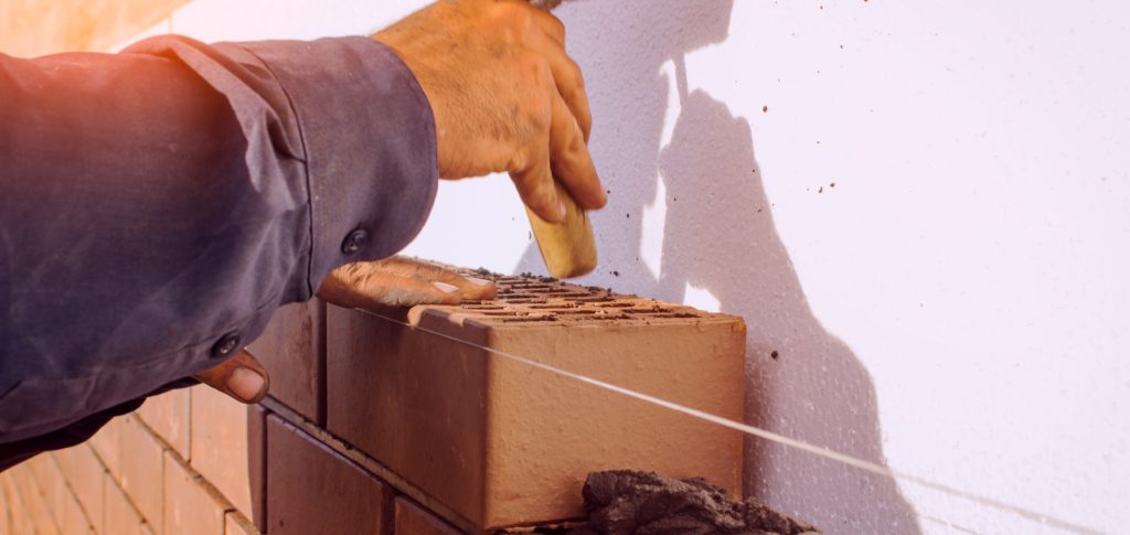 contractor working on brickwork project