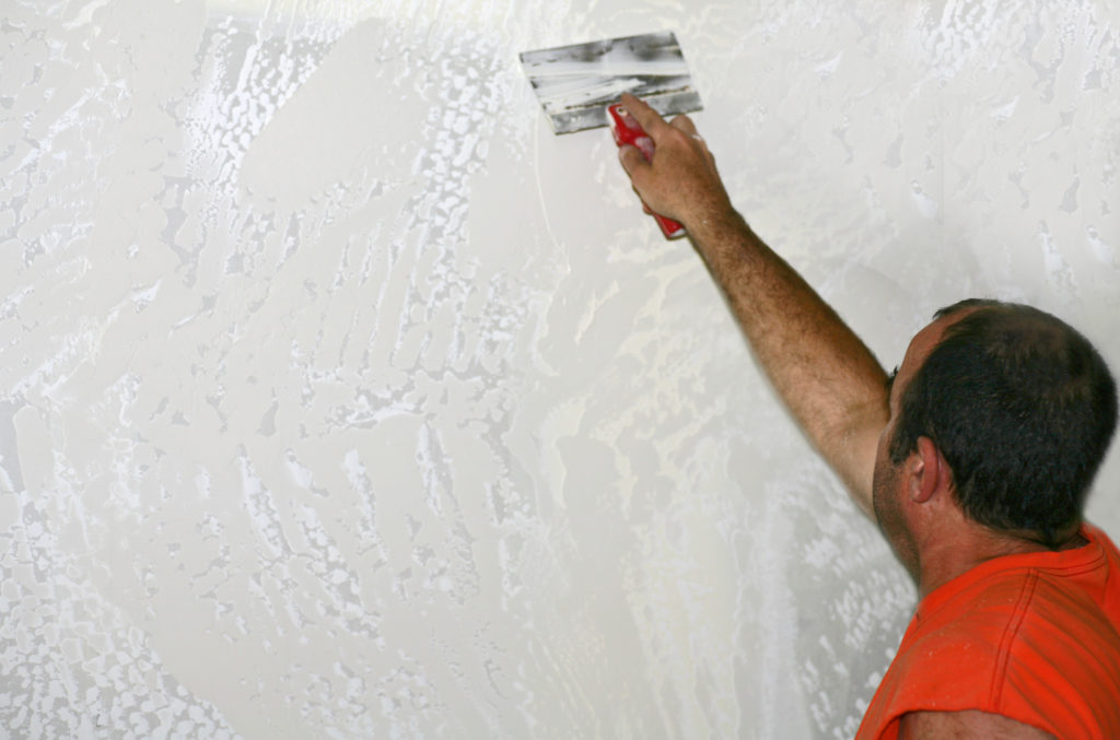 Drywaller Applying Texture to Sheetrock