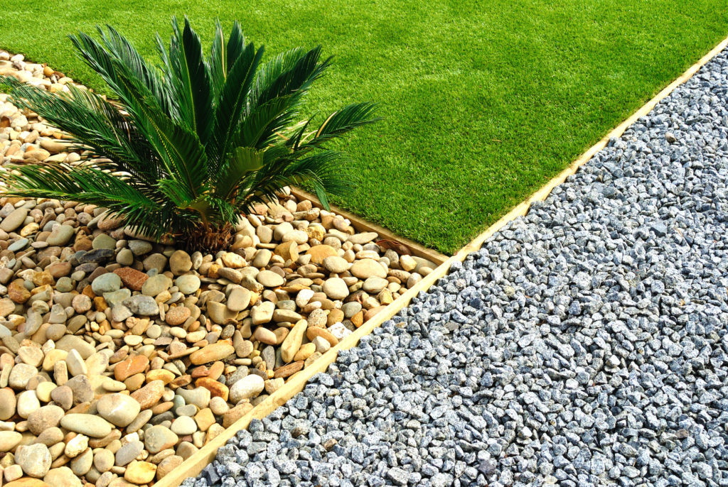 A close-up of landscaping with rocks and grass